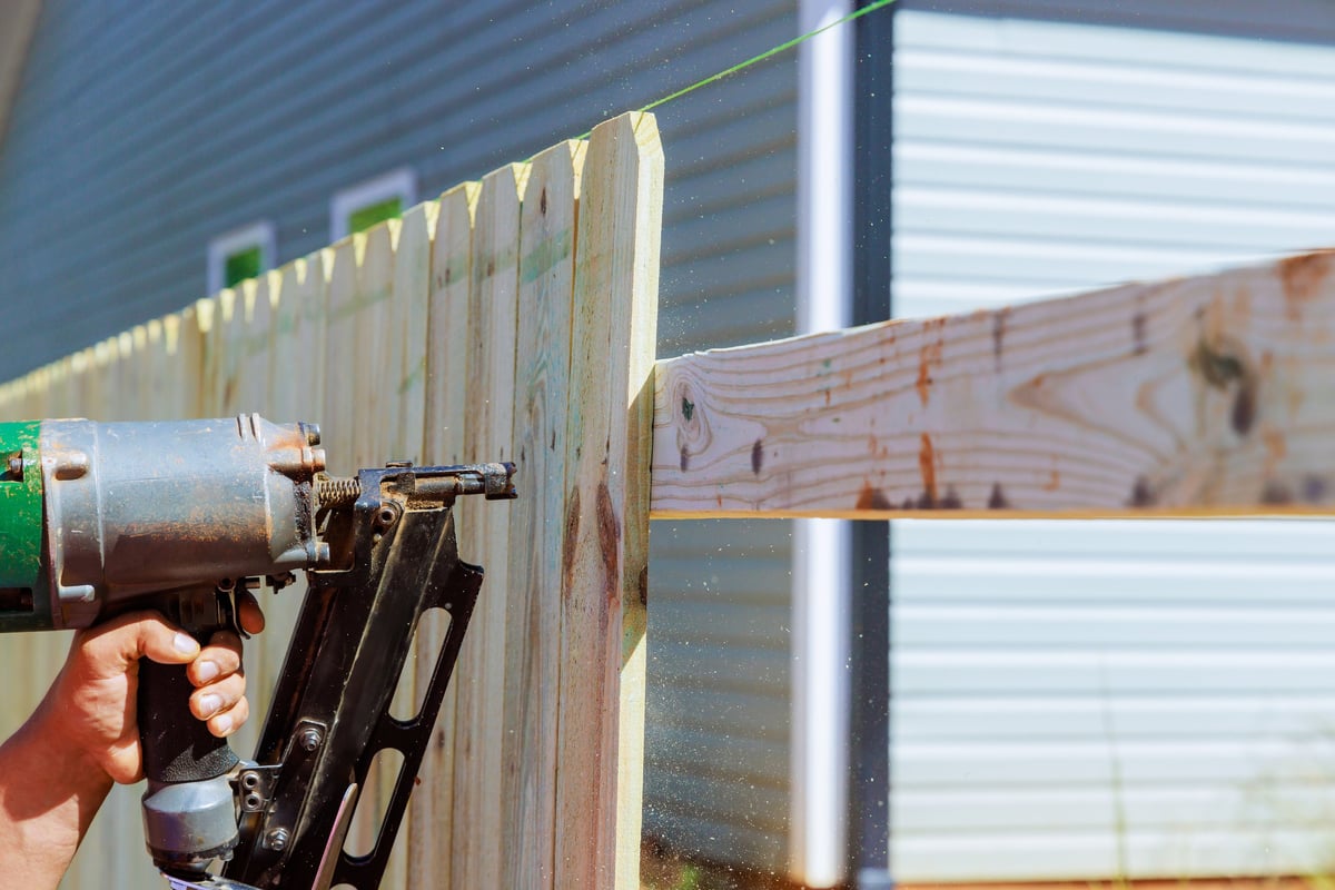 Damaged fence being repaired