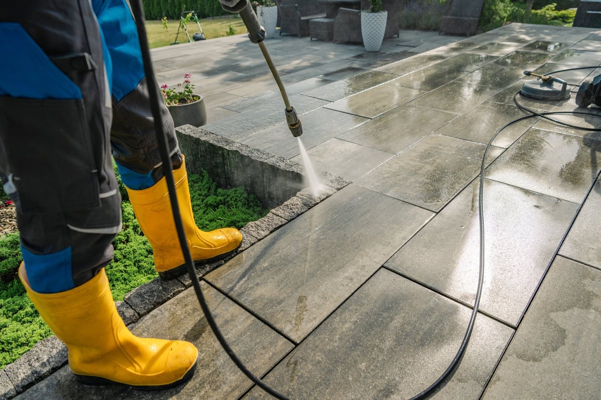 Pressure washing patio cleaning in action